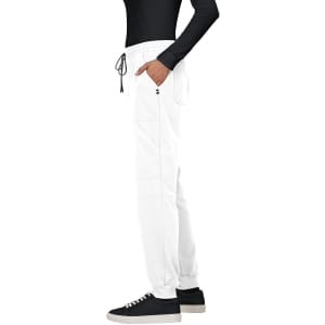 A pair of white jogger pants with a drawstring waistband, featured alongside a black long-sleeve top and black shoes.