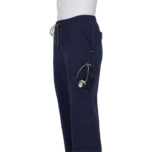 A pair of navy jogger pants featuring side pockets, one holding a stethoscope, and an elastic waistband.