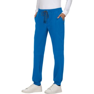 A pair of bright blue jogger pants with a drawstring waist and side pockets, worn with white shoes.