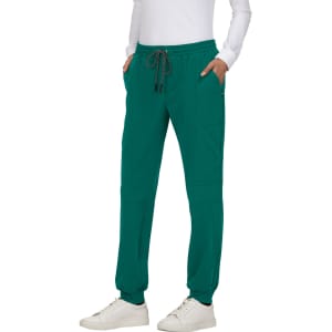 A pair of teal jogger pants with an elastic waistband and side pockets. Features a logo on the garment.