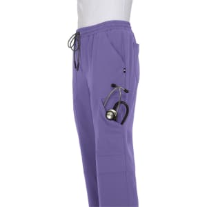 A pair of purple jogger pants featuring a pocket with a stethoscope. The pants have an elastic waistband and drawstrings.