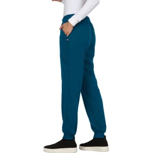 A pair of teal jogger pants with pockets and a relaxed fit, featuring a waistband and ankle cuffs.