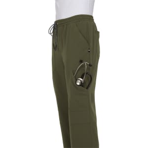 A pair of olive green jogger pants with pockets and a stethoscope tucked into one pocket.