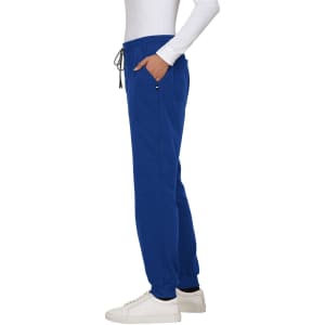 A pair of royal blue jogger pants with an elastic waistband and side pockets, displayed on a model.