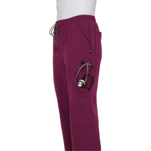 A pair of burgundy jogger pants featuring pockets, including one for a stethoscope, with a drawstring waist.