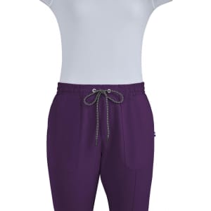 A pair of purple jogger pants with a drawstring waistband, featuring two front pockets and a branding logo.