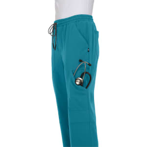 A pair of teal jogger pants featuring a pocket hold a stethoscope. The pants have an elastic waistband and drawstring.