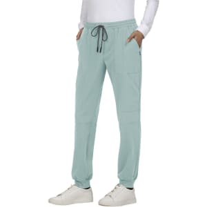 A pair of light blue jogger pants with pockets and a drawstring waist, paired with white sneakers.