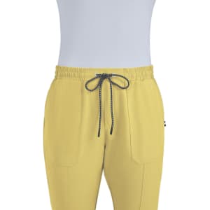 A pair of yellow jogger pants featuring an elastic waistband and drawstring, with two front pockets and a logo.