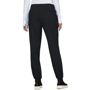 A pair of black jogger pants with an elastic waistband, shown from the back, featuring a simple design and a logo.