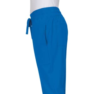 A pair of blue jogger pants featuring an elastic waistband and side pockets. The garment has a logo displayed.