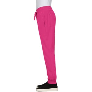 A pair of bright pink jogger pants with an elastic waistband and side pockets, displayed from the side.