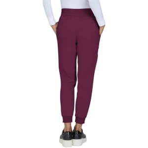 A person wearing maroon Gemma Jogger Pants with an elastic waistband and cuffed ankles, showing the back view.