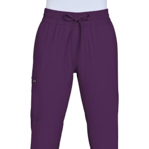 A pair of purple jogger pants with an elastic waistband and drawstring, featuring a side pocket and a logo.