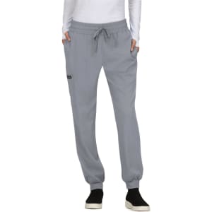 A pair of light grey jogger pants with an elastic waistband and pockets, featuring a small logo on the side.