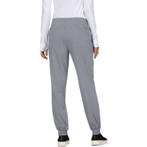A pair of grey jogger pants featuring an elastic waistband and back pockets, with a person wearing them from the back.