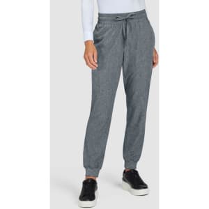 A pair of grey jogger pants featuring an elastic waistband and cuffed ankles, presented on a model.