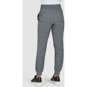 A pair of grey jogger pants featuring a tapered leg and elastic waistband, with pockets and a logo.