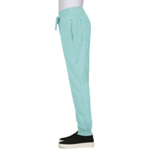 A turquoise jogger pant with elastic waistband and pockets, featuring a logo on the side.