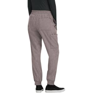 A pair of light mauve jogger pants viewed from the back, featuring an elastic waistband and pockets.