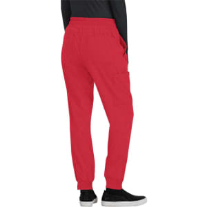 A pair of red jogger pants with side pockets, featuring an elastic waist and a branding logo.