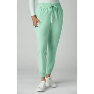 A pair of mint green jogger pants with a drawstring waist and side pockets, featuring a small logo.