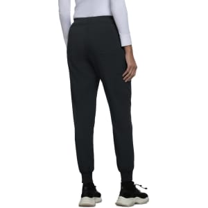 A pair of dark grey jogger pants with cuffed ankles, featuring a streamlined design and a minimalistic look.