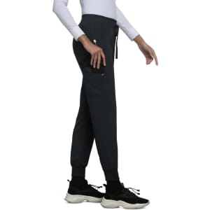 A pair of black jogger pants with a slim fit, featuring a side pocket and an elasticated waistband.