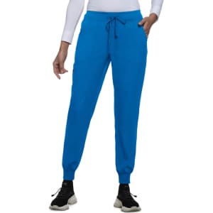 A pair of vibrant blue jogger pants features a drawstring waist and ankle cuffs, with front pockets and a brand logo.