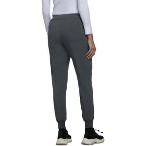A pair of grey joggers with elastic cuffs, featuring a simple design and a subtle branding logo.