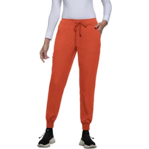 An orange pair of jogger pants with pockets and a drawstring waist, designed for comfort.
