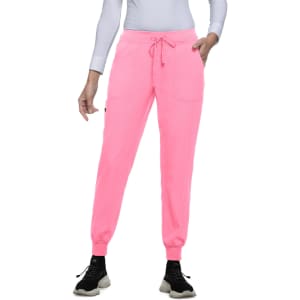 A pair of bright pink joggers with pockets and an elasticated waistband, styled with a light long-sleeve top.