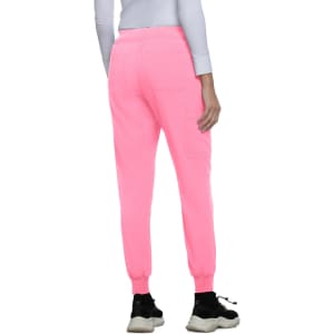 A pair of neon pink jogger pants with elastic cuffs, viewed from the back. Features a branded logo.