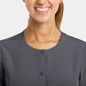 A round neck snap jacket in dark grey, featuring a buttoned front and a simple, stylish design.