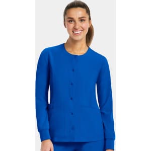 A blue women's round neck snap jacket with long sleeves and two front pockets, featuring a logo.