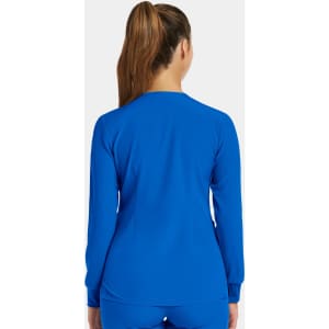 A women's round neck snap jacket in bright blue, featuring long sleeves and a fitted design from the back view.
