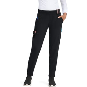 A pair of black jogger pants featuring multiple pockets, worn by a person standing. The pants have an elastic waistband.