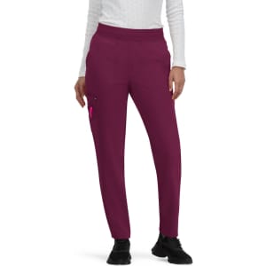 Light purple jogger pants with a side pocket, worn by a person in a white long-sleeve top and black shoes.