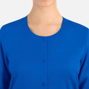 A women's round neck snap jacket in vibrant blue with a button detail at the collar.