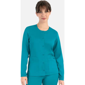 A women's round neck snap jacket in teal, featuring long sleeves and front pockets. It has a logo on the garment.