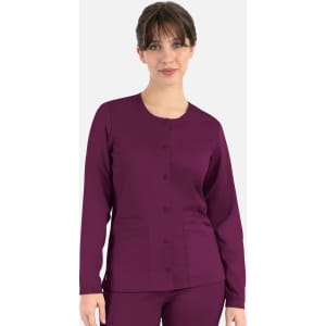 A rounded neck jacket in dark purple, featuring buttons and two front pockets. Model wears the jacket confidently.