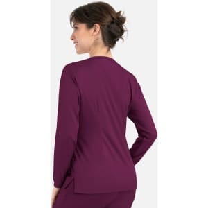 A women's round neck snap jacket in deep purple, featuring a sleek design and a subtle logo.