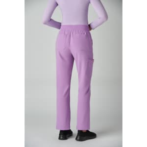 A pair of lavender boot cut pants featuring an elastic waistband and pockets, viewed from the back.