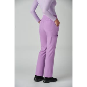 A pair of lilac boot cut pants with pockets, worn by a model from the back.