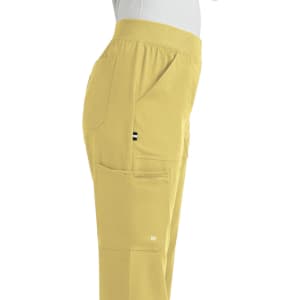 A pair of yellow boot cut pants with multiple side pockets, featuring a logo on one pocket.