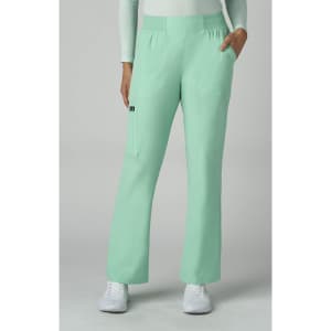 A pair of mint green pants with pockets, displayed on a model wearing a white top and white shoes.