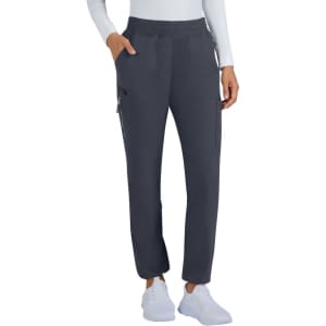 A pair of limited edition navy pants with pockets, featured on a model wearing a white top and white shoes.