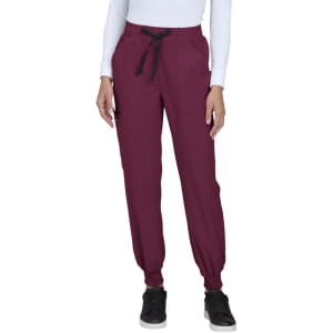 A pair of burgundy jogger pants with a drawstring waist and elastic cuffs, featuring pockets.