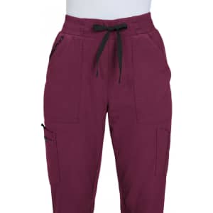 A pair of maroon jogger pants featuring black drawstrings and side pockets, with a logo present on one side.
