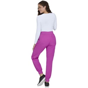 A pair of bright pink jogger pants displayed from the back, paired with a white long-sleeve top.